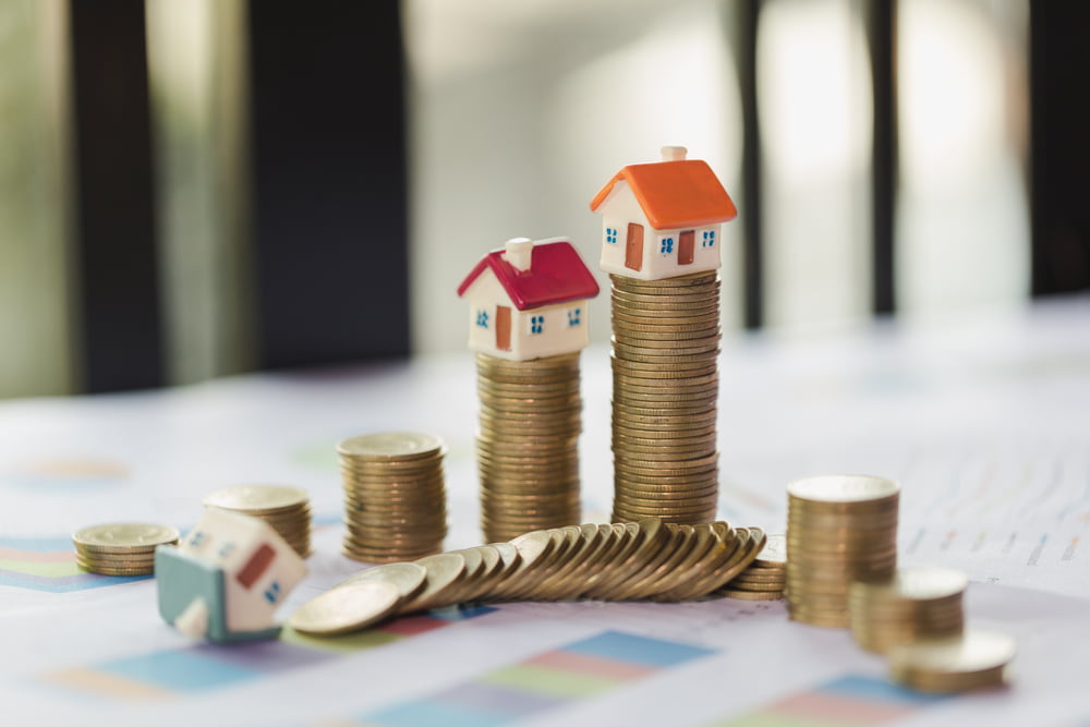 House Model On Top Of Stack Of Money As Growth Of Mortgage Credi